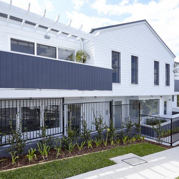 Contemporary environmentally friendly home exterior featuring modern design elements, landscaped garden, and premium finishes, part of Living Green Designer Homes' 'Seabreeze' project.