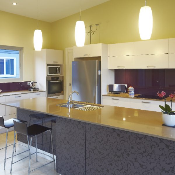 Modern kitchen design featuring energy-efficient appliances, sleek cabinetry, and a central island with a stylish countertop, emphasizing sustainable living and eco-friendly home aesthetics.