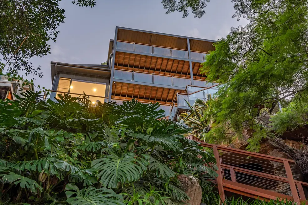 Elevated multi-level custom home built into a steep, bushland sloping site on the Central Coast